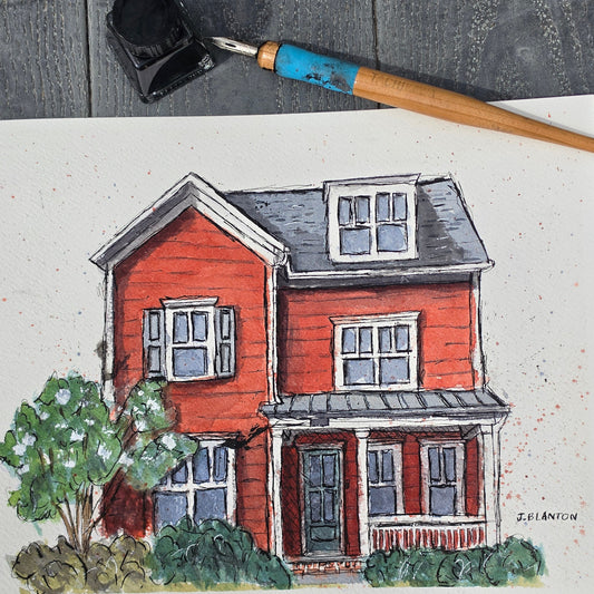 Colorful illustration of a house on paper with a paintbrush next to it.